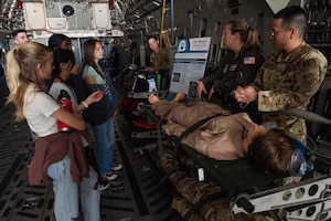 Airmen speak to students on a C-17