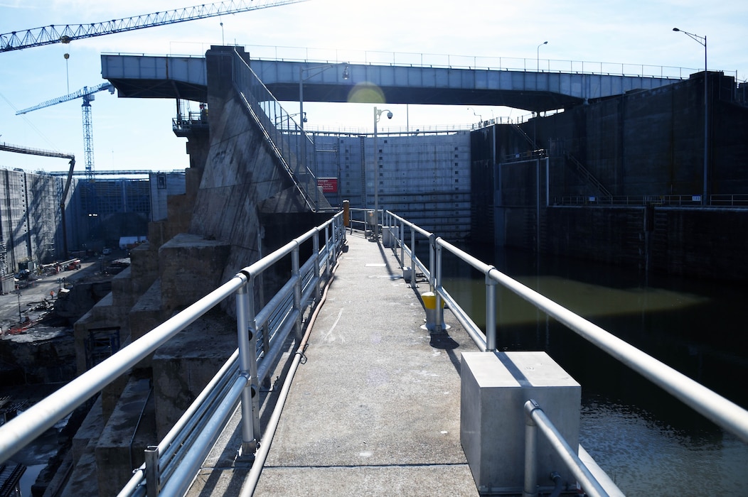 Ongoing construction at the Kentucky Lock mega project in February, 2024. View of the walkway with the original navigation lock on the right, and new lock on the left. (USACE Photo by Matt Dyman)