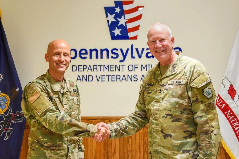 Brig. Gen. Terrence Koudelka Jr., left, poses for a photo with Pennsylvania Adjutant General Maj. Gen. Mark Schindler May 15, 2024, at Fort Indiantown Gap, Pa. Koudelka was recently appointed deputy adjutant general - Air of the Pennsylvania National Guard. (Pennsylvania National Guard photo by Tom Cherry)