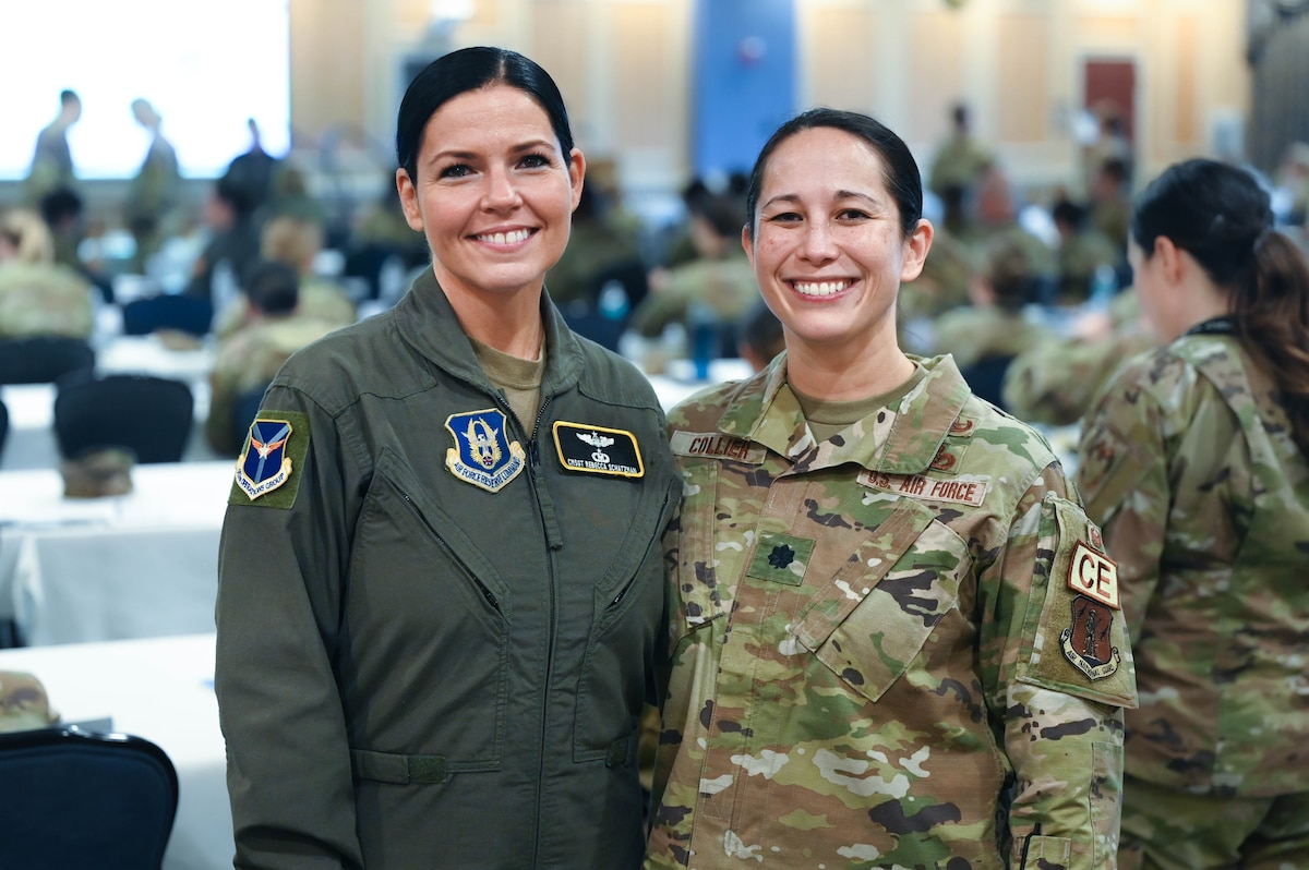 Chief Master Sgt. Rebecca Schatzman, senior enlisted leader for 911th Operations Group, and Lt. Col. Kimberly Collier, 248th Civil Engineer Flight's director of readiness, pose for a photo during the second annual ARC Athena event, April 30, Langley Air Force Base, Virginia. Schatzman and Collier teamed up as co-leads for the event uniting the Air Force Reserve and Air National Guard. (U.S. Air Force photo by Master Sgt. Jeffrey Grossi)