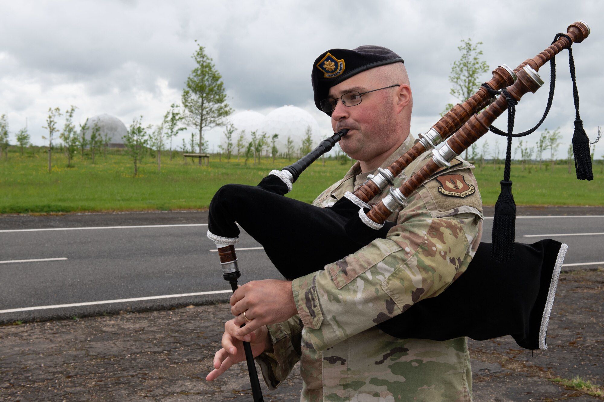 A defender plays the bagpipes