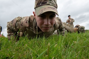 A close up of a defender's face while doing push-ups