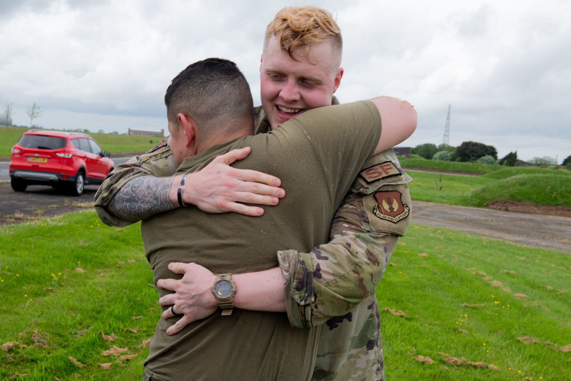 Defenders smile and hug