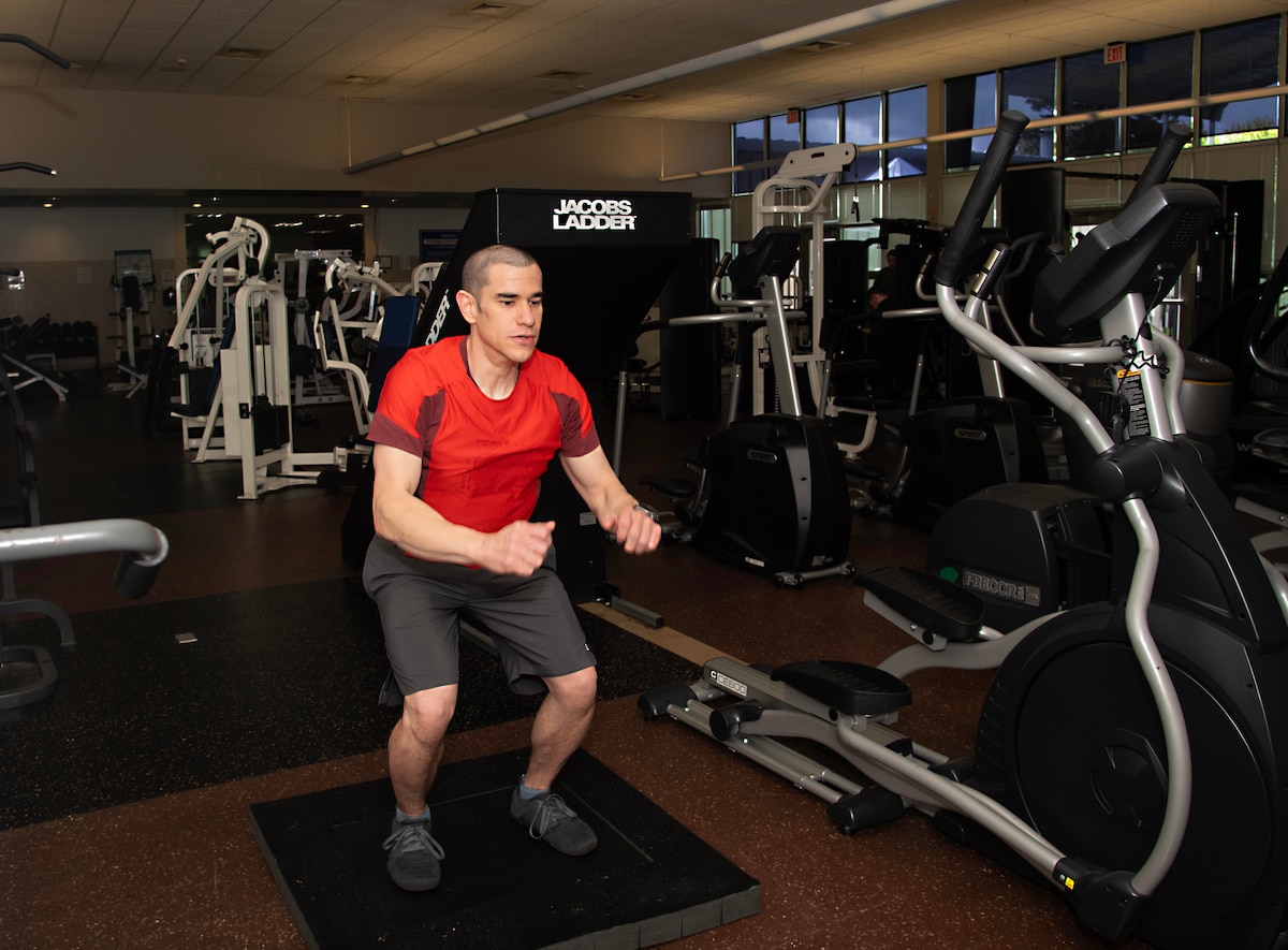 Capt. Daniel Delgado prepares to jump during a Sparta Science Program evaluation at Portland Air National Guard Base, Ore., May 7, 2024. The program uses proprietary force plate technology to assess physical performance in an effort to help athletes prevent sports-related injury. (U.S. Air National Guard photo by Master Sgt. Steph Sawyer)