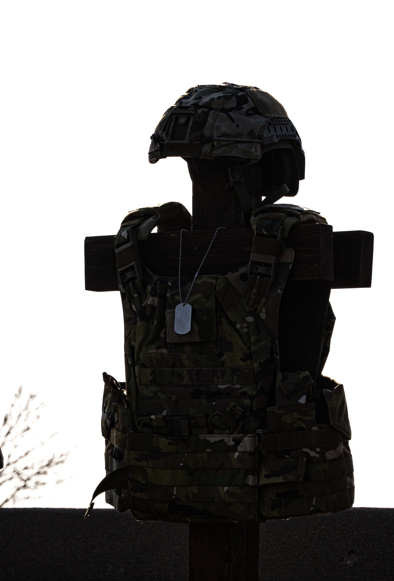 A battlefield cross is displayed at the 2024 National Police Week opening ceremony at Minot Air Force Base, North Dakota, May 13, 2024. The battlefield cross is a symbol of honor and respect for fallen service members. (U.S. Air Force photo by Airman 1st Class Alyssa Bankston)