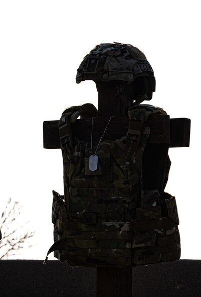 A battlefield cross is displayed at the 2024 National Police Week opening ceremony at Minot Air Force Base, North Dakota, May 13, 2024. The battlefield cross is a symbol of honor and respect for fallen service members. (U.S. Air Force photo by Airman 1st Class Alyssa Bankston)