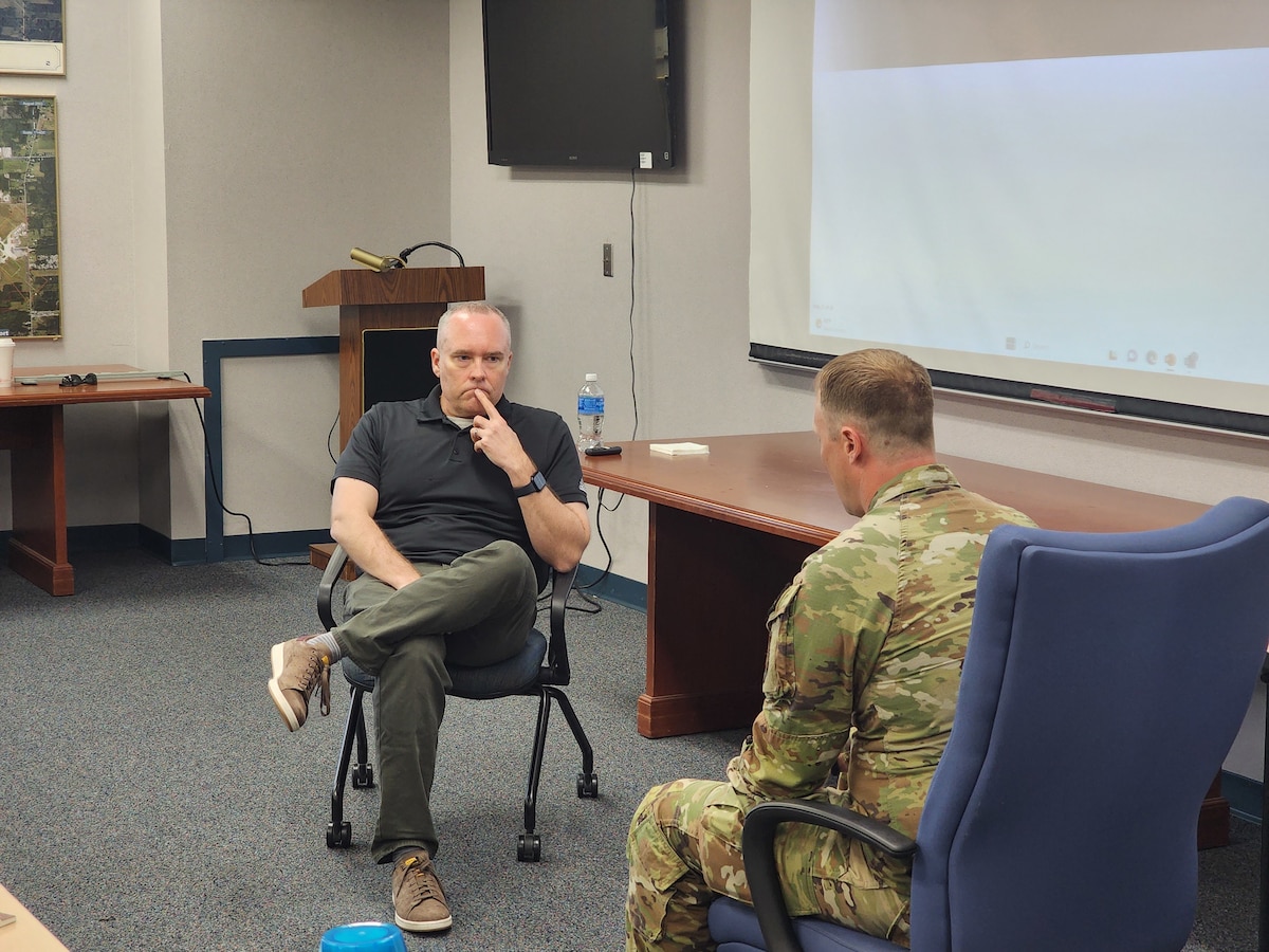 Dr. Craig Bryan, board-certified clinical psychologist with a long list of positions at The Ohio State University, mental health researcher and veteran, facilitates a demonstration conversation to assist an Airman in creating a crisis response plan at Youngstown Air Reserve Station, Ohio, May 3, 2024.