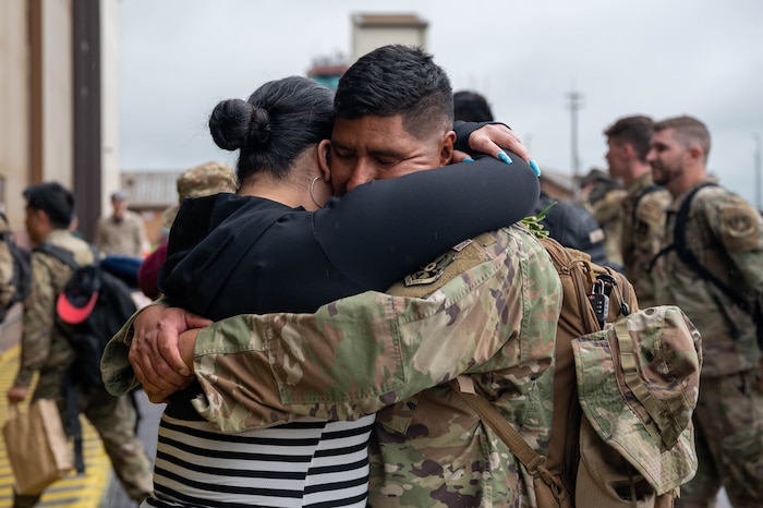 man and woman hugging