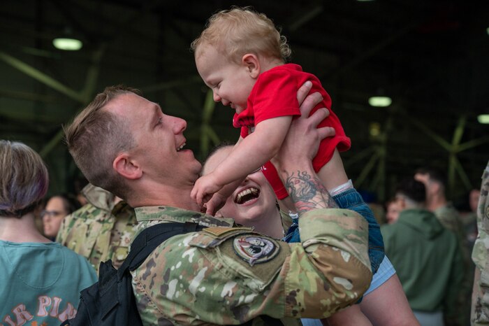 man holding baby