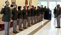 Lt. Gen. Sean A. Gainey, commanding general, U.S. Army Space and Missile Defense Command, commissions Ezekiel Burwell, Trevion Hammonds, Sameria Harris, Gregory Horton, Chloe Johnson, Phillip Jones, Jessica Mendoza, Joel Metuge, Hayden Smith and Taylor Wingo as second lieutenants during the Alabama Agricultural and Mechanical University and University of Alabama in Huntsville’s spring commissioning ceremony, May 2, at AAMU’s Clyde Foster Auditorium. (U.S. Army photo by Jason B. Cutshaw)