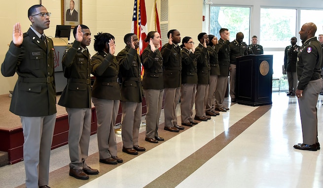 Lt. Gen. Sean A. Gainey, commanding general, U.S. Army Space and Missile Defense Command, commissions Ezekiel Burwell, Trevion Hammonds, Sameria Harris, Gregory Horton, Chloe Johnson, Phillip Jones, Jessica Mendoza, Joel Metuge, Hayden Smith and Taylor Wingo as second lieutenants during the Alabama Agricultural and Mechanical University and University of Alabama in Huntsville’s spring commissioning ceremony, May 2, at AAMU’s Clyde Foster Auditorium. (U.S. Army photo by Jason B. Cutshaw)