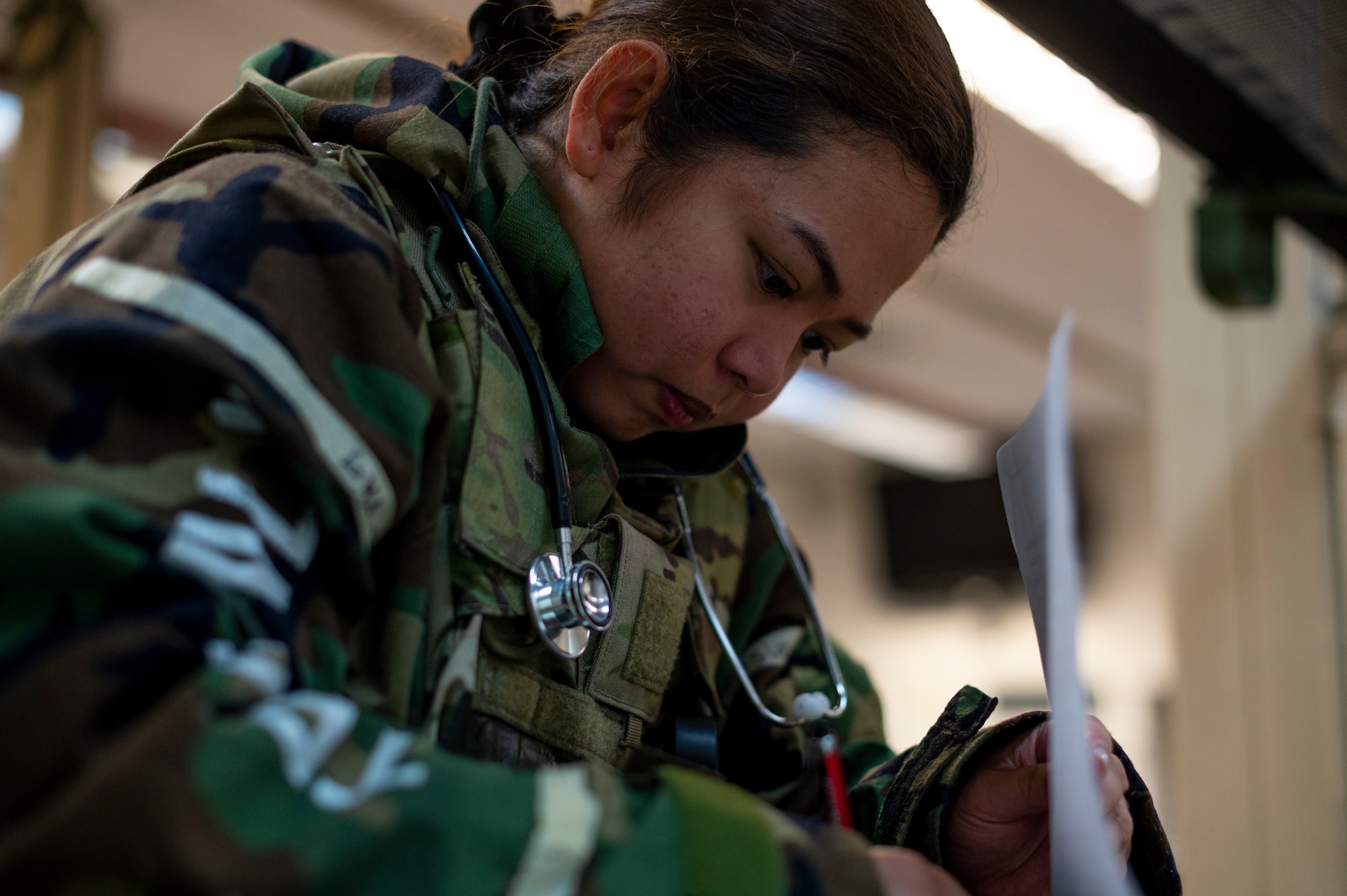 U.S. Air Force Maj. Stephen Morgano, 51st Operational Medical Readiness Squadron mental health social worker, checks on U.S. Air Force Senior Airman Gilberto Deleon, 51st Operations Support Squadron aircrew flight equipment journeyman, after performing tactical combat care during Beverly Herd 24-1 at Osan Air Base, Republic of Korea, May 16, 2024. During the training event, personnel from the 51st Medical Group delivered life-saving care, showcasing their dedication to readiness. The Airmen of the 51st Fighter Wing continuously train to maintain the high level of full-spectrum readiness required to execute the mission proficiently and effectively. (U.S. Air Force photo by Senior Airman Kaitlin Frazier)