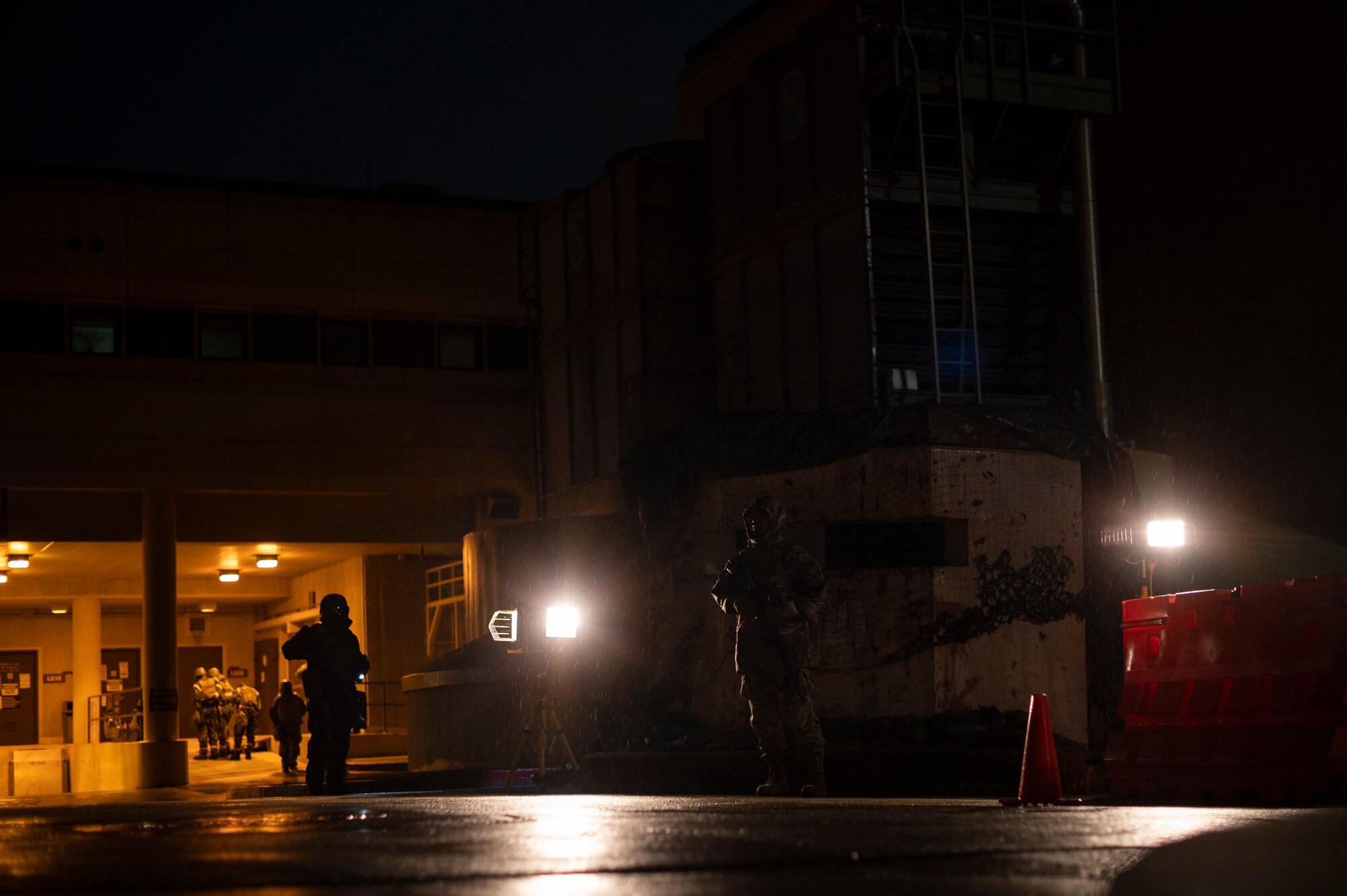 Airmen assigned to the 51st Fighter Wing stand guard at a defensive fighting position during Beverly Herd 24-1 at Osan Air Base, Republic of Korea, May 16, 2024. The mission of the 51st MDG is to maintain and ensure medical readiness for contingencies by providing high-quality, trusted care for approximately 8,000 enrollees and 20,000 beneficiaries. As the most forward deployed permanently based wing in the Air Force, the 51st Fighter Wing is charged with providing mission-ready Airmen to execute combat operations and receive follow-on forces. (U.S. Air Force photo by Senior Airman Kaitlin Frazier)