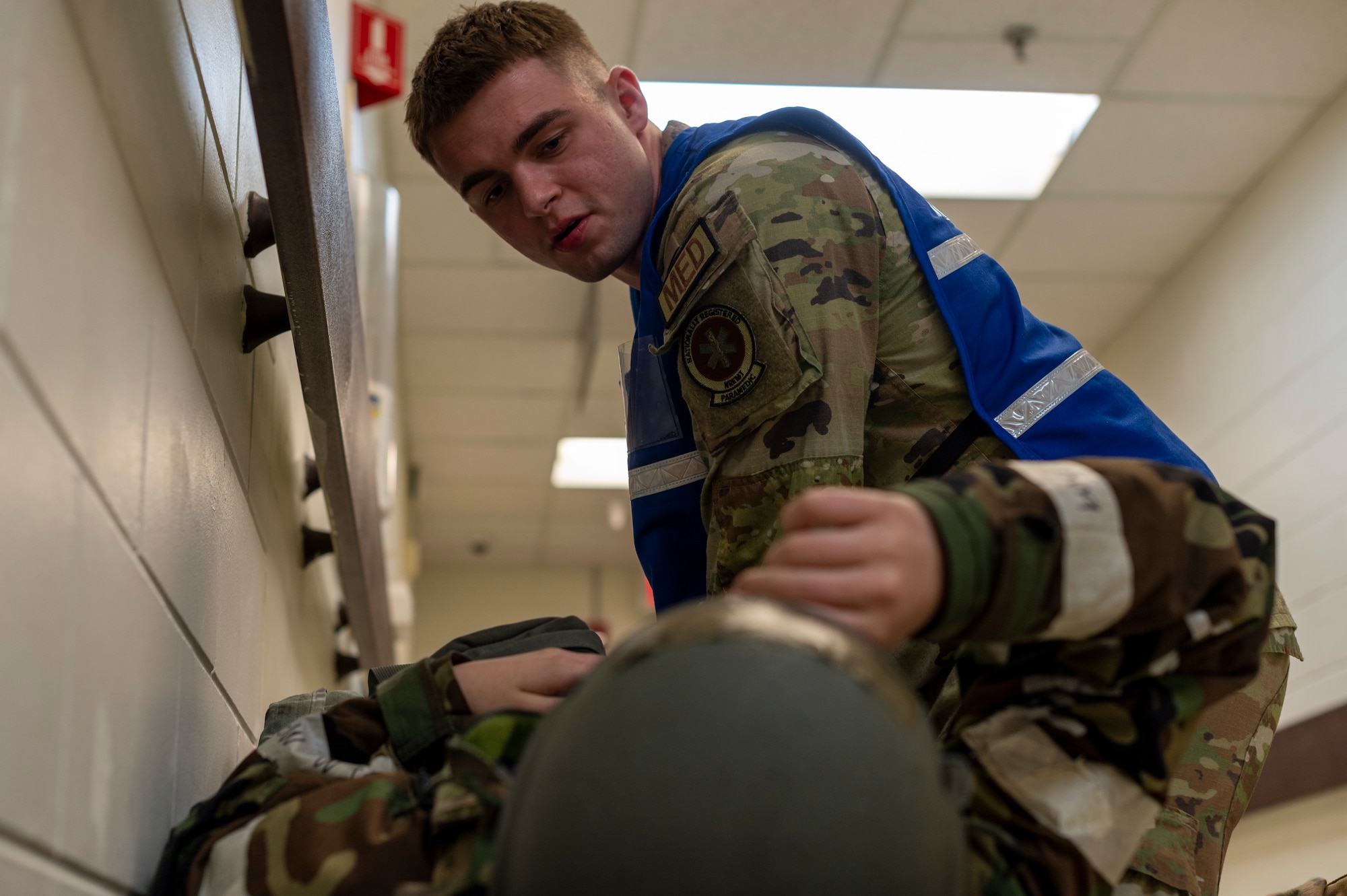U.S. Air Force Senior Airman Braxton Anderson, 51st Operational Readiness Squadron paramedic, checks on a simulated patient during Beverly Herd 24-1 at Osan Air Base, Republic of Korea, May 16, 2024. Simulated patients came to the 51st MDG with various ailments, providing an opportunity for medical Airmen to assess their capability to effectively treat patients and hone their skills in contingency operations. Training is continuously conducted to generate combat airpower at a moment’s notice, affirming the commitment to the Republic of Korea remains ironclad and ensures regional stability throughout the U.S. Indo-Pacific Command. (U.S. Air Force photo by Senior Airman Kaitlin Frazier)