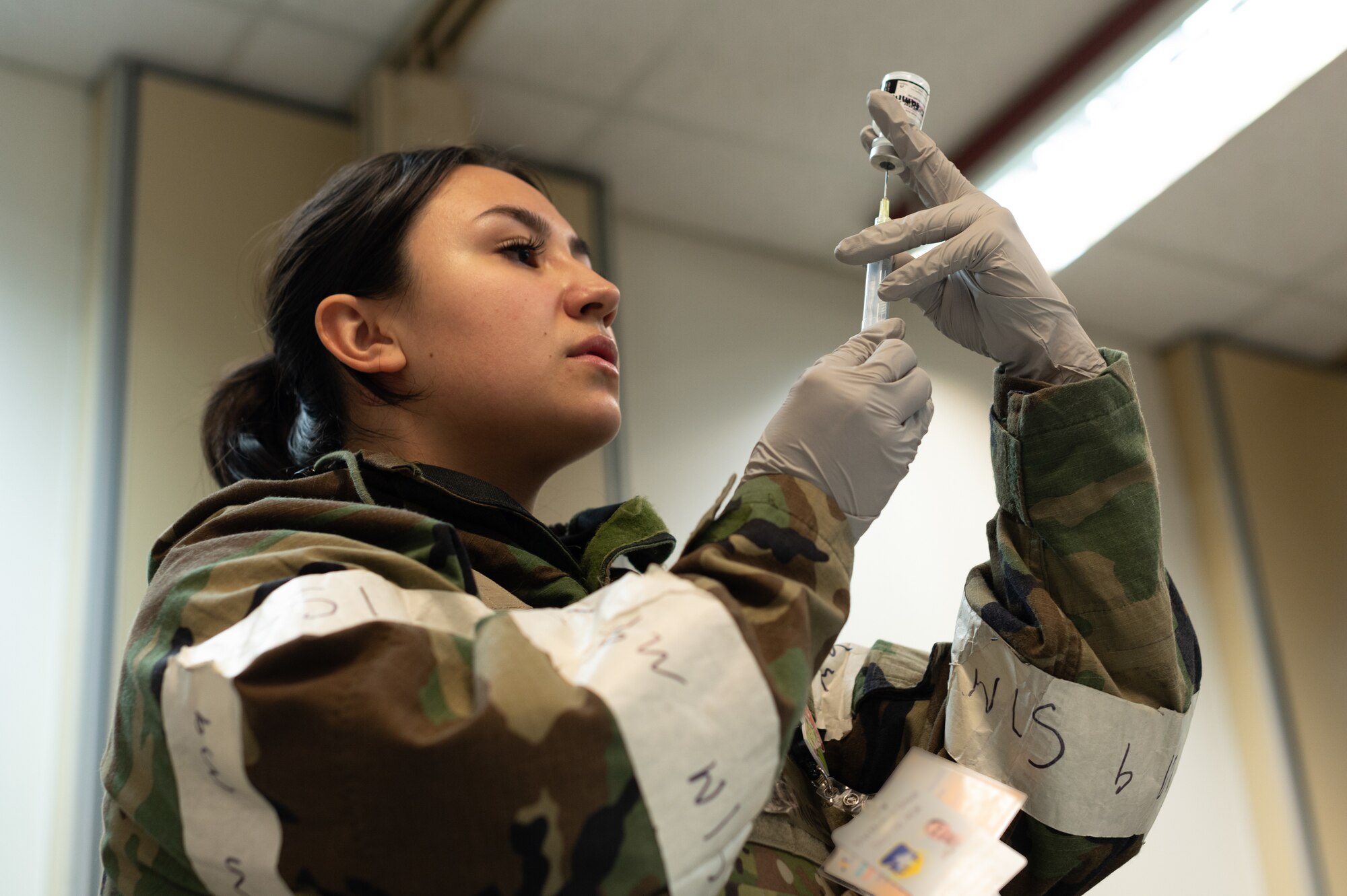 U.S. Air Force Senior Airman Patricia Harvey, 51st Medical Support Squadron pharmacy vault custodian, prepares an injection in a simulated mass casualty during Beverly 24-1 at Osan Air Base, Republic of Korea, May 16, 2024. The mission of the 51st MDG is to maintain and ensure medical readiness for contingencies by providing high-quality, trusted care for approximately 8,000 enrollees and 20,000 beneficiaries. The Airmen of the 51st Fighter Wing continuously train to maintain the high level of full-spectrum readiness required to execute the mission proficiently and effectively. (U.S. Air Force photo by Senior Airman Kaitlin Frazier)