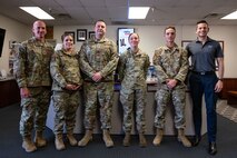 Chief Master Sgt. of the Air Force David Flosi, and the Honorable Alex Wagner, Assistant Secretary of the Air Force for Manpower and Reserve Affairs, pose for a group photo with Airmen assigned to the 99th Air Base Wing during a visit to Nellis Air Force Base, Nevada, May 7, 2024.