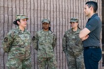 The Honorable Alex Wagner, Assistant Secretary of the Air Force for Manpower and Reserve Affairs, converses with Airmen from the Nellis Pride Council during a visit to Nellis Air Force Base, Nevada, May 7, 2024.