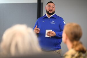 Image of person briefing during a meeting.