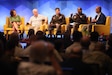 Marcia B. Holmes, Principal Deputy Assistant Secretary of Defense for Mission Capabilities, Office of the Under Secretary of Defense for Research and Engineering, left, Dr. T. X. Hammes, Distinguished Research Fellow, Institute for National Strategic Studies, National Defense University,  LTG Xavier T. Brunson, Commanding General, I Corps, United States Army & LTG David M. Hodne, Director, Futures and Concepts Center, discuss the importance of innovation and adaptation at the 11th Annual Land Forces Pacific Symposium and Exposition 2024, in Honolulu, Hawaii, May 14, 2024. (U.S. Army photo by Spc. Taylor Gray)