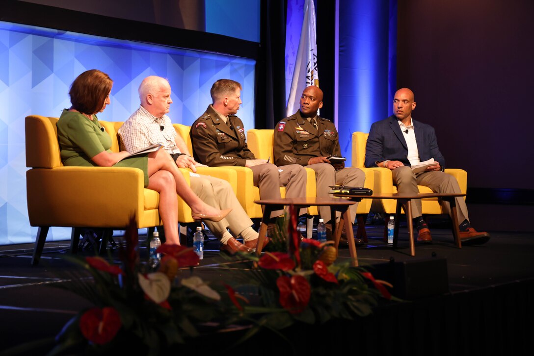 Marcia B. Holmes, Principal Deputy Assistant Secretary of Defense for Mission Capabilities, Office of the Under Secretary of Defense for Research and Engineering, left, Dr. T. X. Hammes, Distinguished Research Fellow, Institute for National Strategic Studies, National Defense University,  LTG Xavier T. Brunson, Commanding General, I Corps, United States Army & LTG David M. Hodne, Director, Futures and Concepts Center, discuss the importance of innovation and adaptation at the 11th Annual Land Forces Pacific Symposium and Exposition 2024, in Honolulu, Hawaii, May 14, 2024. (U.S. Army photo by Spc. Taylor Gray)
