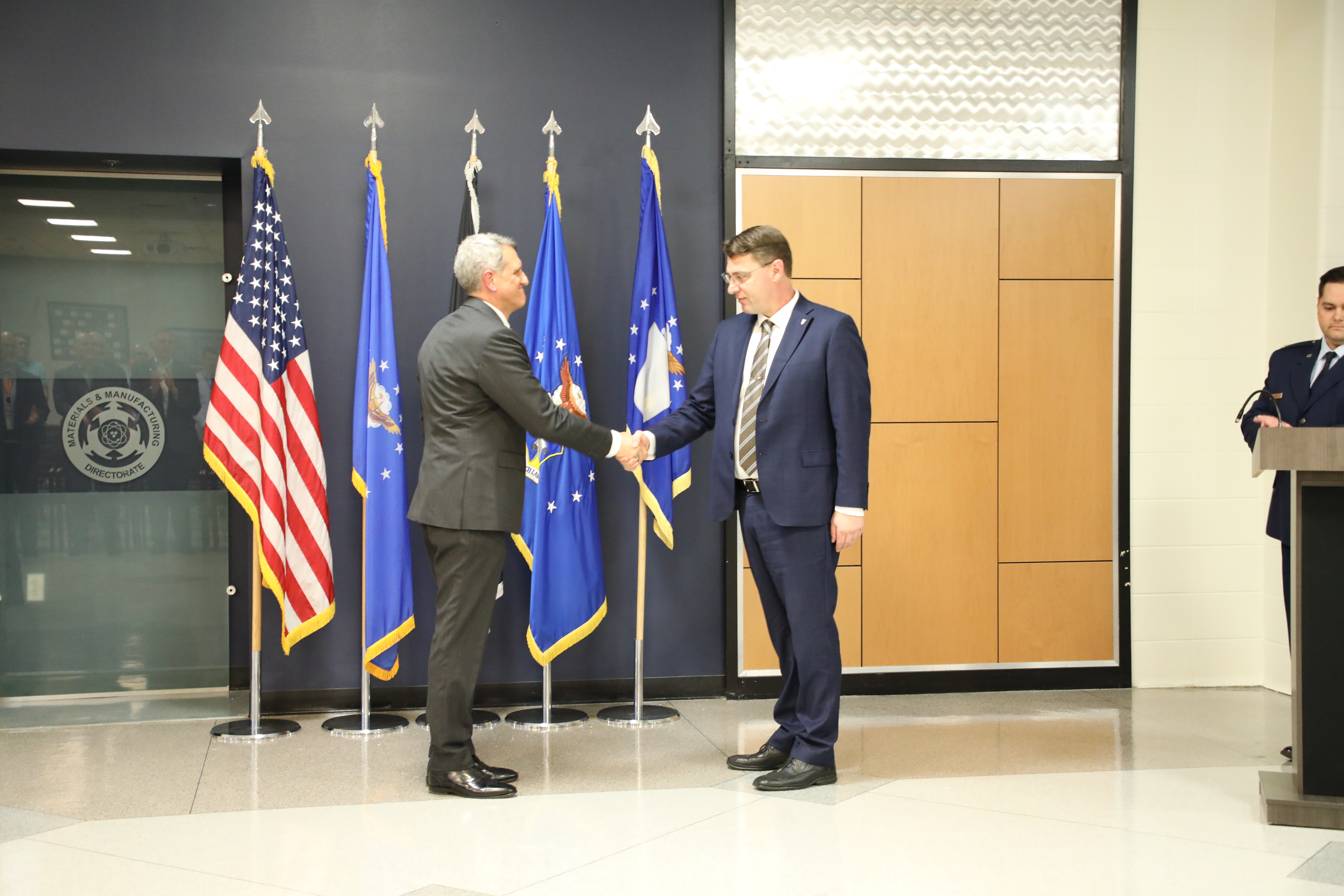 Air Force Research Laboratory Executive Director Timothy Sakulich publicly administers the oath of office to Dr. Mark Benedict at a ceremony to mark his induction into the Scientific and Professional Cadre of Senior Executives at Wright-Patterson Air Force Base, May 9, 2024. Benedict officially accepted the role of senior scientist for convergent (digital) manufacturing at AFRL’s Materials and Manufacturing Directorate in February. 
U.S. Air Force photo / Sarah Perez