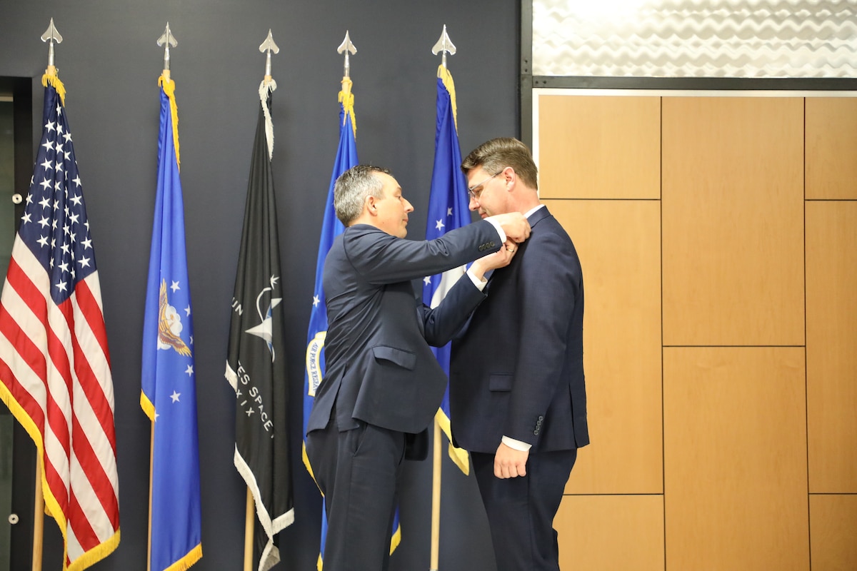 Darrell Phillipson, director of AFRL’s Materials and Manufacturing Directorate, presents Dr. Mark Benedict with the senior executive pin during a ceremony to mark his induction into the Scientific and Professional Cadre of Senior Executives at Wright-Patterson Air Force Base, May 9, 2024. Benedict officially accepted the role of senior scientist for convergent (digital) manufacturing at the Air Force Research Laboratory, or AFRL’s, Materials and Manufacturing Directorate in February.U.S. Air Force photo / Sarah Perez