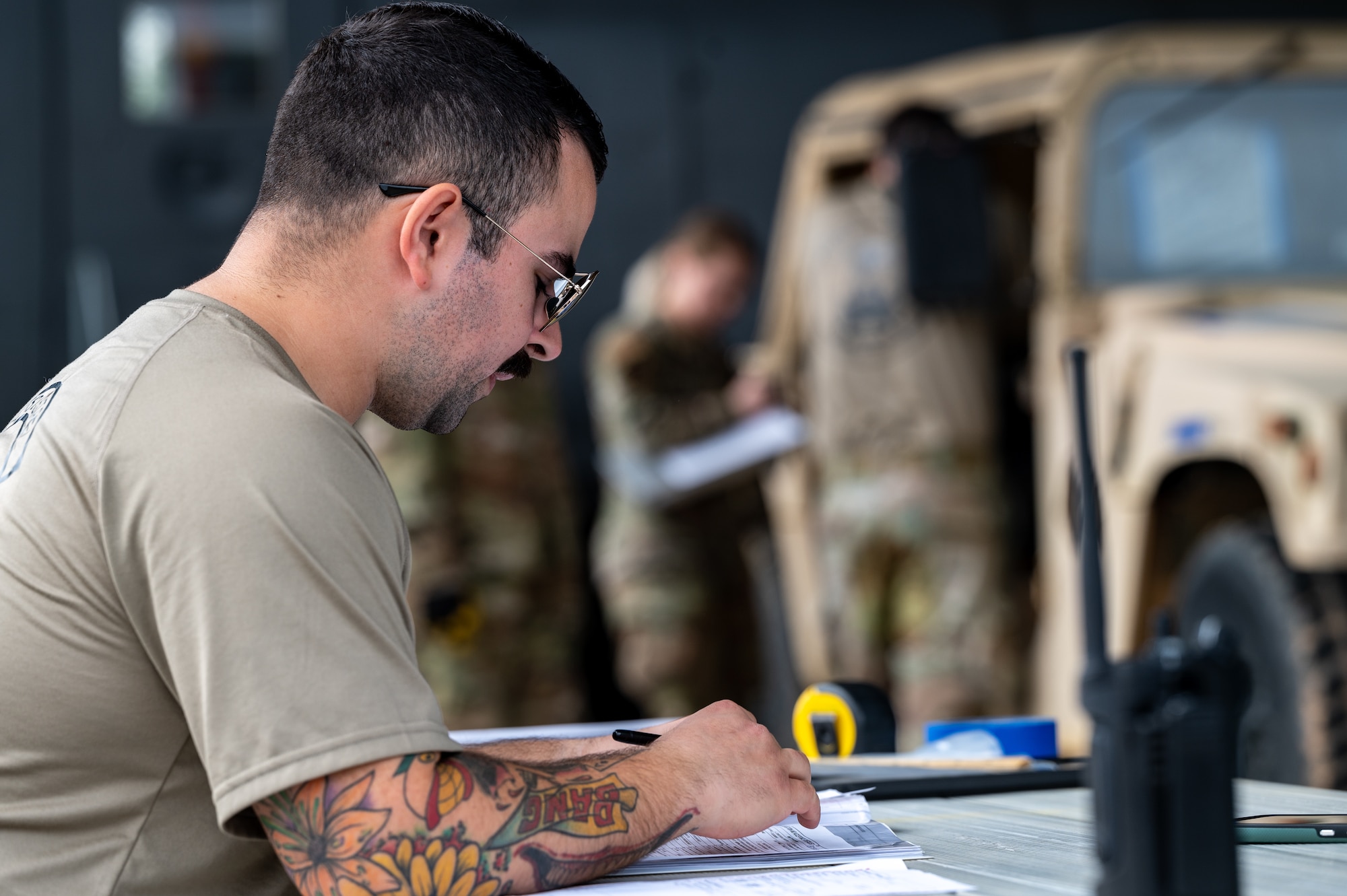 Tech. Sgt. Brandon Martinez, ramp specialist at the 32nd Aerial Port Squadron, annotates the cargo information during the Joint Inspection Cargo Load event at the 2024 Port Dawg Challenge at Dobbins Air Reserve Base, Georgia, April 16, 2024. This process allows aerial porters to validate airworthiness of assets loading into an aircraft, cargo must be inspected and measured for accountability and for safety of the air crew. (U.S. Air Force photo by Master Sgt. Diana E. Ferree)