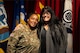 Female U.S. Army Soldier poses with friend after promotion ceremony