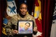 Female U.S. Army Soldier holding a picture frame