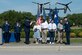 U.S. Air Force Lt. Gen. Tony Bauernfeind, commander of Air Force Special Operations Command, presents the Distinguished Flying Cross to the family of U.S. Air Force Senior Master Sgt. James Lackey, a CV-22B Osprey flight engineer, on his behalf at the Voas-Lackey Roundabout at Hurlburt Field, Florida, May 16, 2024. Lackey posthumously received the DFC for his actions taken during a combat mission near Qalat, Afghanistan, April 9, 2010. (U.S. Air Force photo by Staff Sgt. Jason Huddleston)