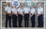 Members of the Migrant Interdiction Operations Application Team who attended the Innovation Awards ceremony at Coast Guard Headquarters on May 2, 2024, receive recognition for creating an app that streamlined processing of migrants. From left: Lt. Kailee Evereteze, Lt. Cmdr. Shawn Antonelli, Lt. Garen Anderson, Lt. John Roddy, Lt. Victoria Martucci, Lt. Cmdr. Nick Phillips. (U.S. Coast Guard photo by Petty Officer 2nd Class Ronald Hodges Jr)