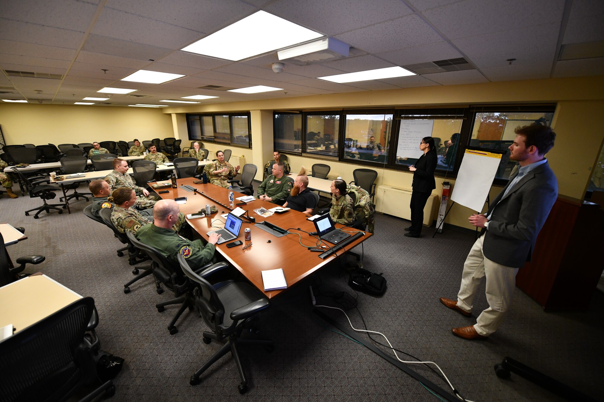 Commanders discuss at a conference table