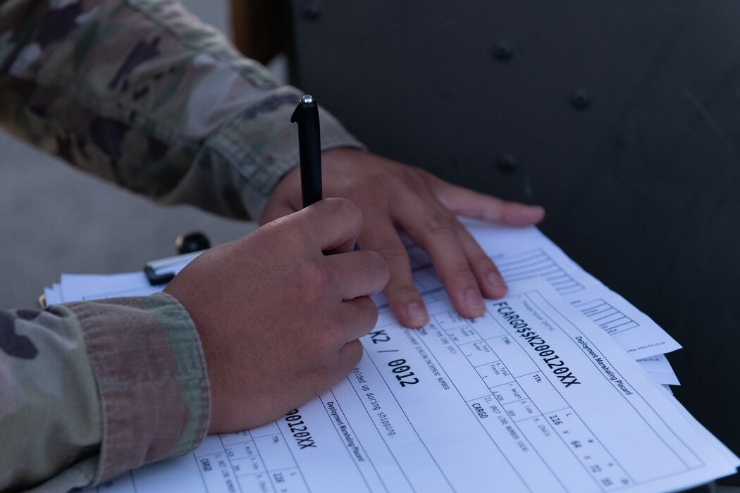 An Airman completes shipping forms.