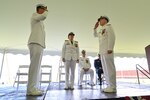 US Coast Guard Atlantic Area Vice Admirals Nathan Moore and Kevin Lunday salute one another while Coast Guard Commandant Adm. Linda Fagan presides over a change-of-command ceremony, May 16, 2024, in Yorktown, Virginia. The change-of-command ceremony is a military tradition representing a formal transfer of authority and responsibility for a unit from one commanding or flag officer to another. The passing of colors, standards, or ensigns from an outgoing commander to an incoming one ensures that the unit and its members are never without official leadership, a continuation of trust. (U.S. Coast Guard photo by Petty Officer 2nd Class Brandon Hillard)