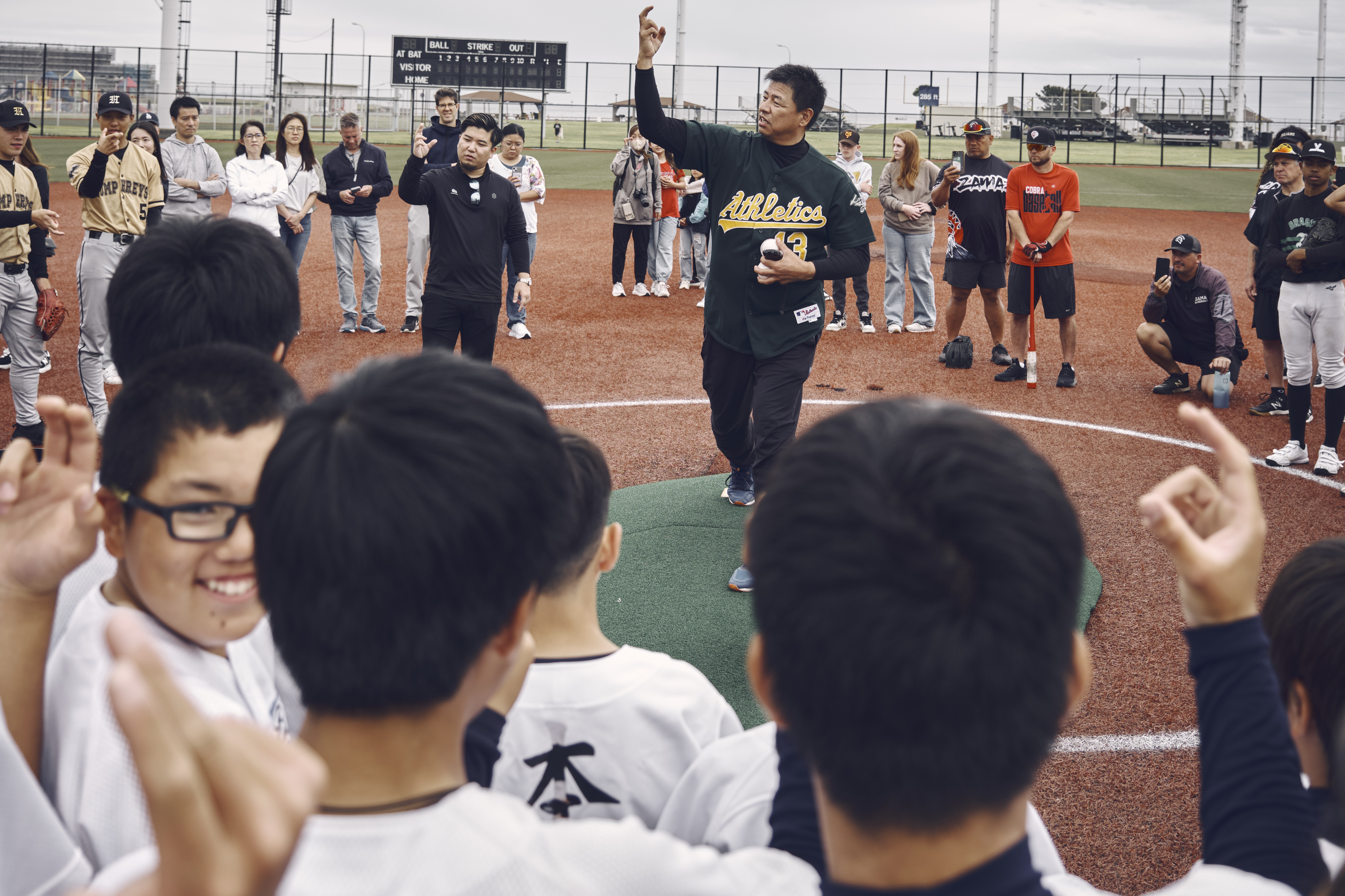 Former Major League Baseball and Nippon Professional Baseball pitcher Keiichi Yabu coaches high school all-stars from the Far East Tournament and Yokohama Bay during Pro Day 2024 May 12, 2024 at Commander, Fleet Activities Yokosuka's Berkey Field.