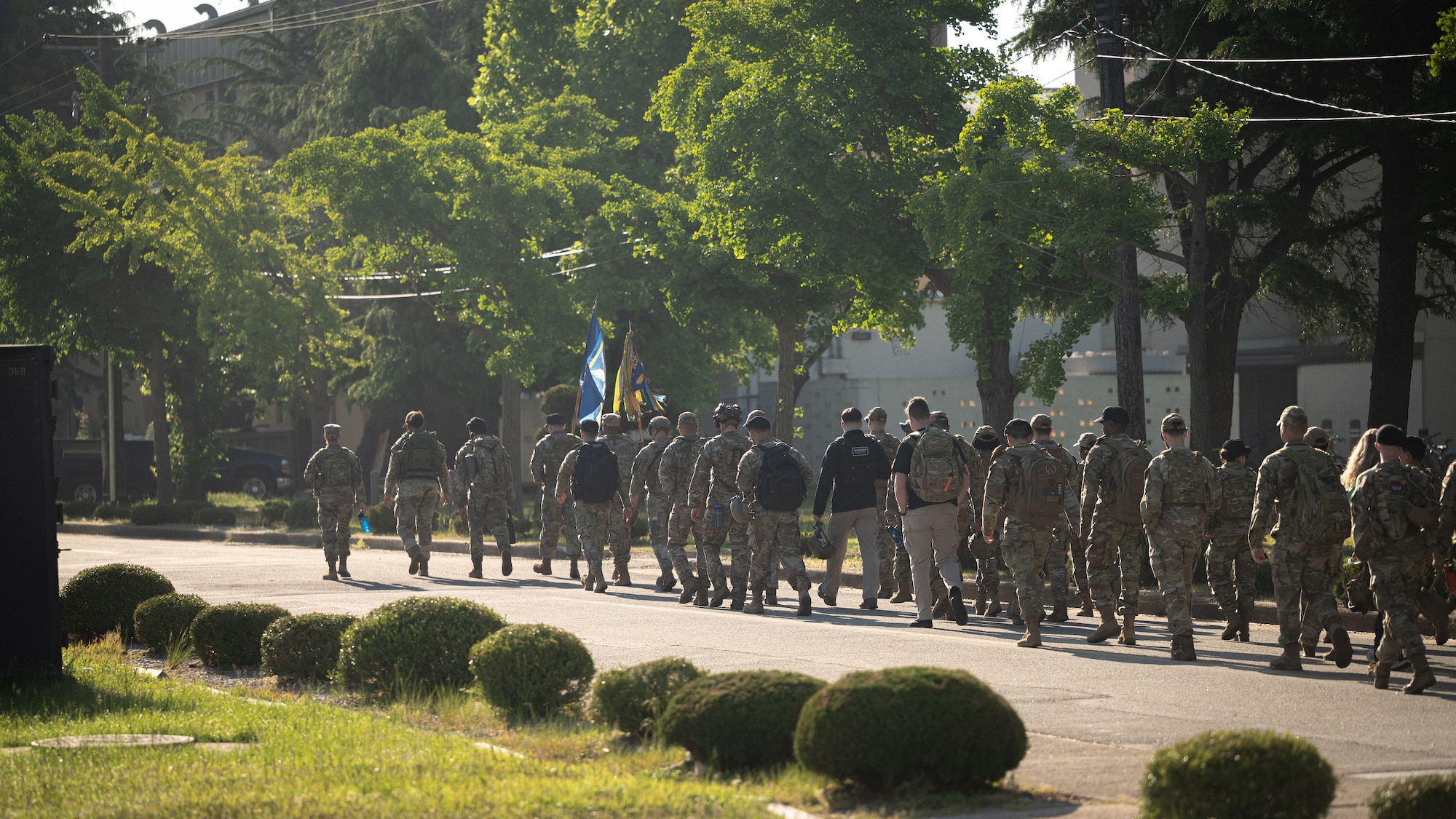 8th Security Forces Squadron Airmen begin an organized ruck march after the opening ceremony of Police Week.