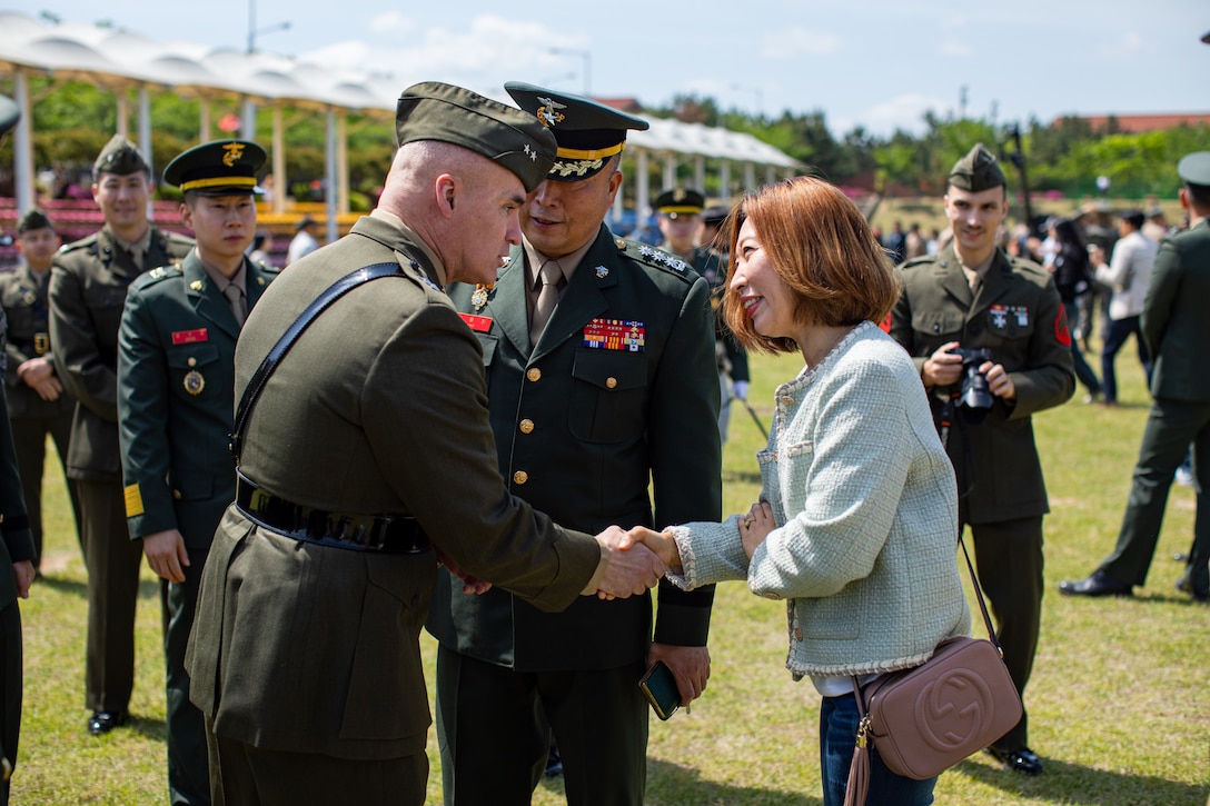 U.S. Marine Corps Maj. Gen. W. “Wes” E. Souza III, commanding general for U.S. Marine Corps Forces Korea, congratulates a Republic of Korea Marines family member during a ROK Marine Corps bootcamp graduation in Pohang, South Korea, May 2, 2024. MARFORK is the U.S. Marine Corps Service component for United States Forces Korea and United Nations Command. MARFORK commands all U.S. Marine Forces assigned to USFK and UNC; as well as advises on the Marine Corps capabilities, support and proper employment of Marine Forces. (U.S. Marine Corps photo by Cpl. Dean Gurule)