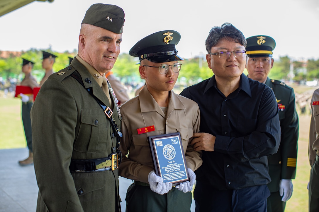 U.S. Marine Corps Maj. Gen. W. “Wes” E. Souza III, commanding general for U.S. Marine Corps Forces Korea, poses for a photo with a Republic of Korea Marine during a ROK Marine Corps bootcamp graduation in Pohang, South Korea, May 2, 2024. MARFORK is the U.S. Marine Corps Service component for United States Forces Korea and United Nations Command. MARFORK commands all U.S. Marine Forces assigned to USFK and UNC; as well as advises on the Marine Corps capabilities, support and proper employment of Marine Forces. (U.S. Marine Corps photo by Cpl. Dean Gurule)