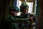 U.S. Marine Corps Sgt. Tyler Jordan, a native of Illinois and a machine gunner with 3rd Littoral Combat Team, 3rd Marine Littoral Regiment, 3rd Marine Division, moves through urban terrain alongside a  Philippine Marine with Marine Battalion Landing Team 10 while conducting urban operations training during Balikatan 24 at Paredes Air Station, Philippines, April 27, 2024. BK 24 is an annual exercise between the Armed Forces of the Philippines and the U.S. military designed to strengthen bilateral interoperability, capabilities, trust, and cooperation built over decades of shared experiences. (U.S. Marine Corps photo by Cpl. Malia Sparks)