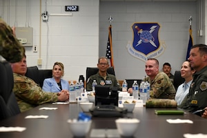 U.S. Air Force Gen. Ken Wilsbach, commander of Air Combat Command and his wife, Cindy Wilsbach, and Chief Master Sgt. David Wolfe, command chief of ACC, and his wife, Dr. Doniel Wolfe, listen to an introduction brief about the 350th Spectrum Warfare Wing during a wing tour at Eglin Air Force Base, Florida, April 10, 2024. The ACC Command Team visited Eglin to learn more about the 350th SWW and the 53rd Wing’s missions to provide combat capabilities to the Air Force. (U.S. Air Force photo by Capt. Benjamin Aronson)