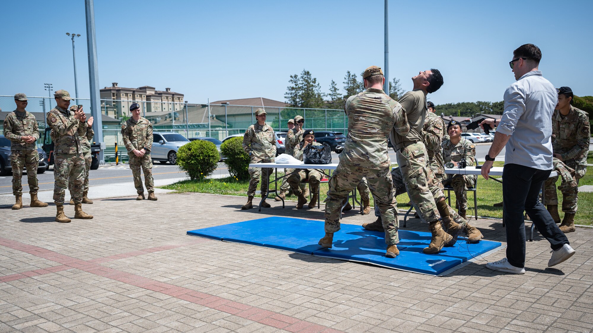 The 8th Security Forces Squadron provides a taser demonstration during Police Week.