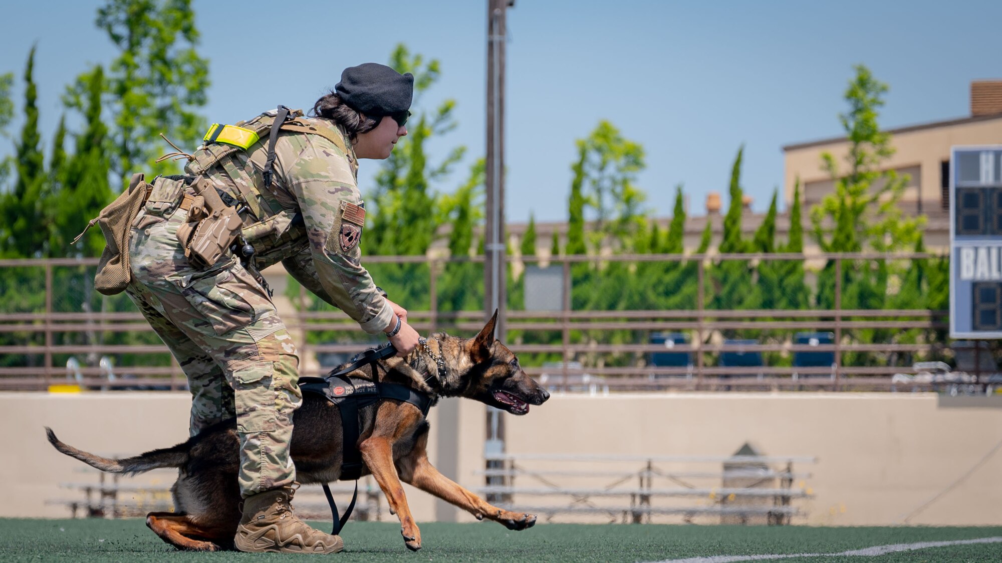 Senior Airman Adriana Mendez and Xxochitl perform a demonstration during Police Week.