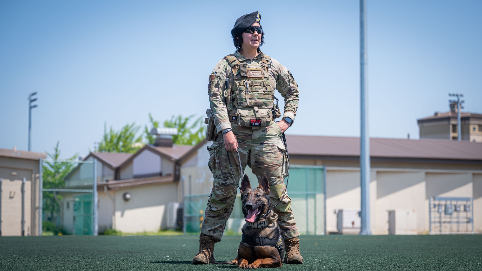 Senior Airman Adriana Mendez nd Xxochitl perform a demonstration during Police Week