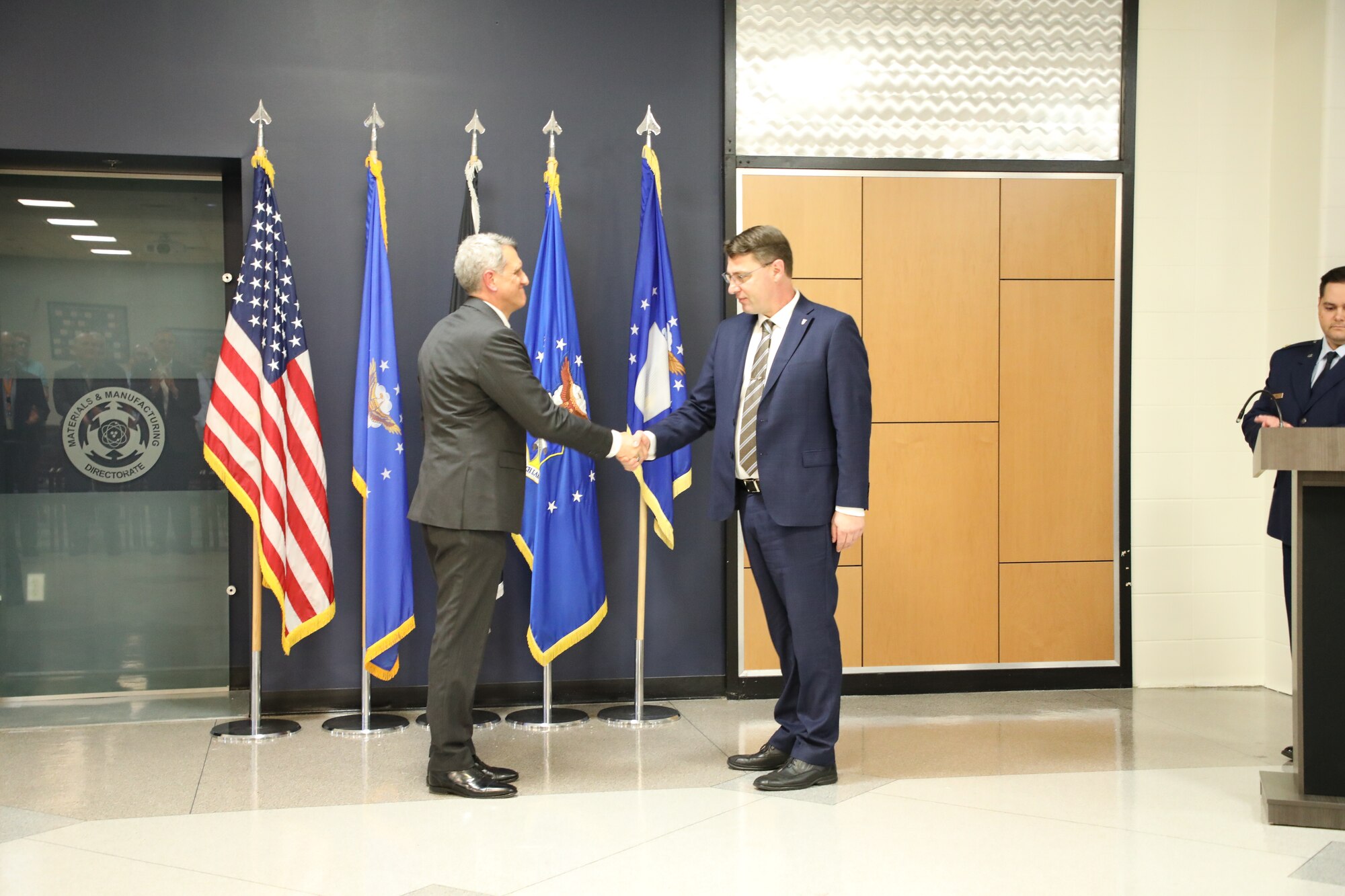 Air Force Research Laboratory Executive Director Timothy Sakulich publicly administers the oath of office to Dr. Mark Benedict at a ceremony to mark his induction into the Scientific and Professional Cadre of Senior Executives at Wright-Patterson Air Force Base, May 9, 2024. Benedict officially accepted the role of senior scientist for convergent (digital) manufacturing at AFRL’s Materials and Manufacturing Directorate in February. 
U.S. Air Force photo / Sarah Perez