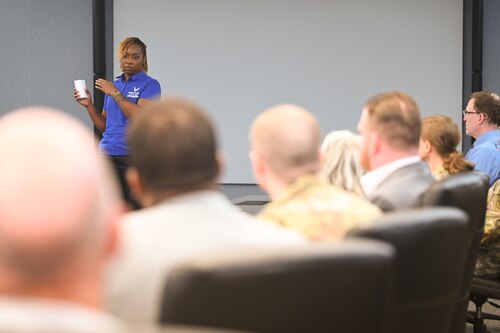Image of person briefing during a meeting.