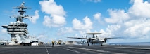 240513-N-BR246-1114 SOUTH CHINA SEA (May 13, 2024) An E-2D Hawkeye, assigned to the “Liberty Bells” of Carrier Airborne Early Warning Squadron (VAW) 115, launches off the flight deck of the Nimitz-class aircraft carrier USS Theodore Roosevelt (CVN 71) during a VAW-115 change of command ceremony, May 13, 2024. During the ceremony, U.S. Navy Cmdr. Charles Diehl assumed command from Cmdr. Glenn Smith. Theodore Roosevelt, flagship of Carrier Strike Group Nine, is underway conducting routine operations in the U.S. 7th Fleet area of operations. U.S. 7th Fleet is the U.S. Navy’s largest forward-deployed numbered fleet, and routinely interacts and operates with allies and partners in preserving a free and open Indo-Pacific region. (U.S. Navy photo by Mass Communication Specialist Seaman Apprentice Aaron Haro Gonzalez)