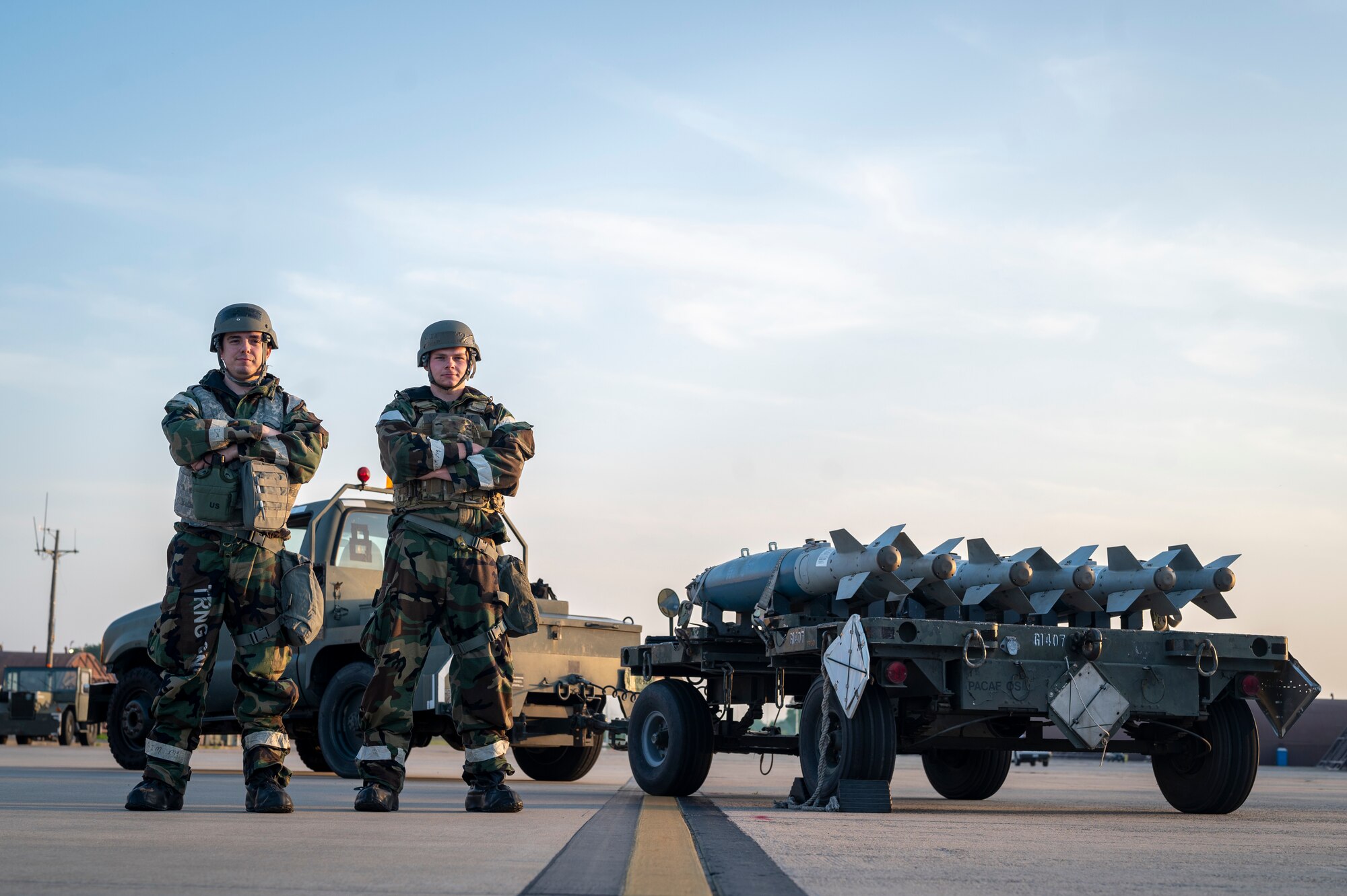 U.S. Air Force Senior Airmen Daniel Boehm left, and Matthew Hodgdon, 51st Munitions Squadron line delivery crew chiefs, stand together in mission-oriented protective posture level two during Beverly Herd 24-1 at Osan Air Base, Republic of Korea, May 16, 2024. The 51st MUNS provide armament systems and quality munitions wherever and whenever needed to enable the 51st Fighter Wing to execute the mission. Training is conducted throughout the year to generate combat airpower at a moment’s notice, affirming the commitment to the Republic of Korea remains ironclad and ensures regional stability throughout the U.S. Indo-Pacific Command. (U.S. Air Force photo by Senior Airman Sabrina Fuller-Judd)