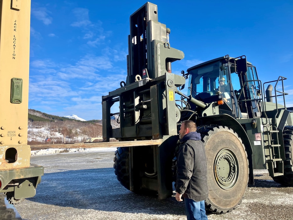 NMRLC's Senior Civilian of the Quarter, Matthew Gerten, supervises the movement of heave equipment while in Norway. Gerten also played a critical role in NMRLC logistics operation with EMF 144 at Camp Foster, Japan.