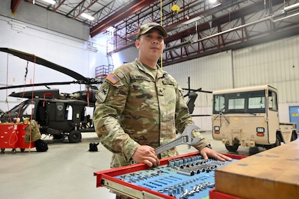 U.S. Army Sgt. Justin Weaver, UH-60 Black Hawk maintainer, District of Columbia Army National Guard, stands for a photograph at Davison Army Airfield, Va., April 16, 2024. DCARNG Aviation is comprised of four different units with AAPIs visibly represented in all sections from pilots and maintainers to administration and operations.