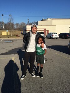 CW2 Christopher Alora stands with his “little” brother, Josiah Jackson, after a basketball game in Clarksville, Tn. CW2 Alora first volunteered with Big Brother Big Sisters of America beginning in 2014. He’s committed to being a role model and enhancing civic consciousness for today’s youth and young adults.